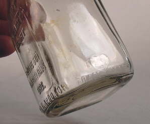 Close-up of the Blake-Hart milk bottle mark; click to enlarge.