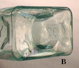 Close-up of the base of the newer Halls Balsam bottle.