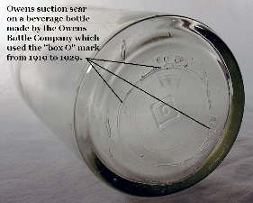 Owens machine scar on the base of a 1920's beverage bottle; click to enlarge.